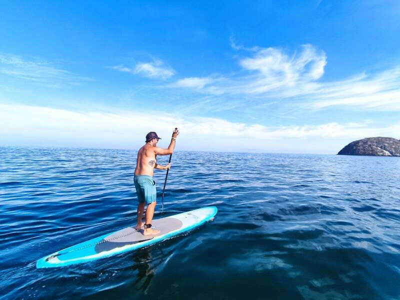 Mismaloya: Stand-Up Paddleboard & Snorkeling to Los Arcos - Passing through the stone arches